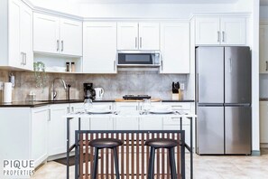 Fridge, microwave, stovetop, coffee/tea maker