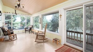 A spacious room with large windows, a wooden ceiling, and a chandelier. - Scenic Stillwater Retreat in rural KY Horse Country, WiFi/AC, Fishing/Canoeing (Georgetown)