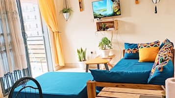 Apartamento Deluxe, balcón | Zona de estar