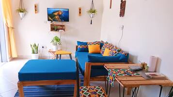 Deluxe Apartment, Balcony | Living area