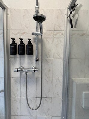 Shower, hair dryer, towels, soap