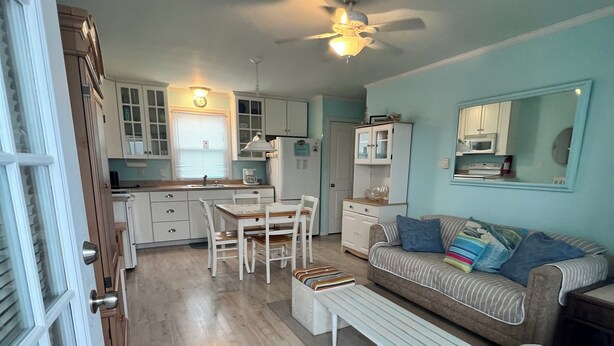 A compact living space with a kitchenette, a dining area, and a seating area with a sofa and a small table. - Beach Block! 1 bedroom condo!Perfect for 2 people.Must be 25 years old to stay. (Seaside Heights)
