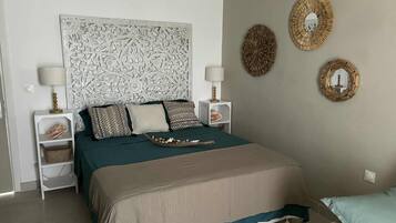1 bedroom, desk, iron/ironing board, travel crib