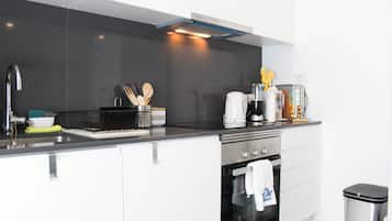 Departamento, vista a la ciudad | Cocina privada