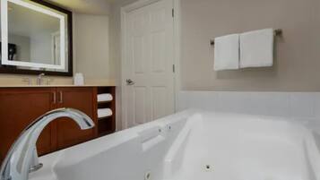 Jetted tub, hair dryer, towels, soap