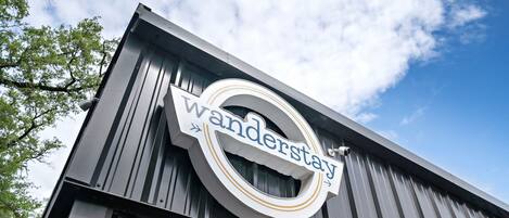 A building with a sign that reads "Wanderstay."