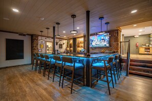 Enjoy a drink at the bar, where you can watch your favorite sports event on the TV screen.