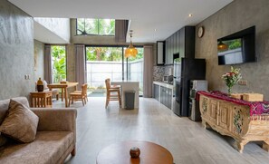 Villa | Living area | 25-inch TV with satellite channels