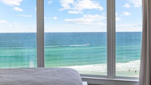 A room with a large window overlooking a beach and ocean. - Beachside 2 Sandestin by Gibson BR  (Miramar Beach)