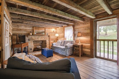 Creekside historic log cabin w/ modern amenities at historic Wade's Mill