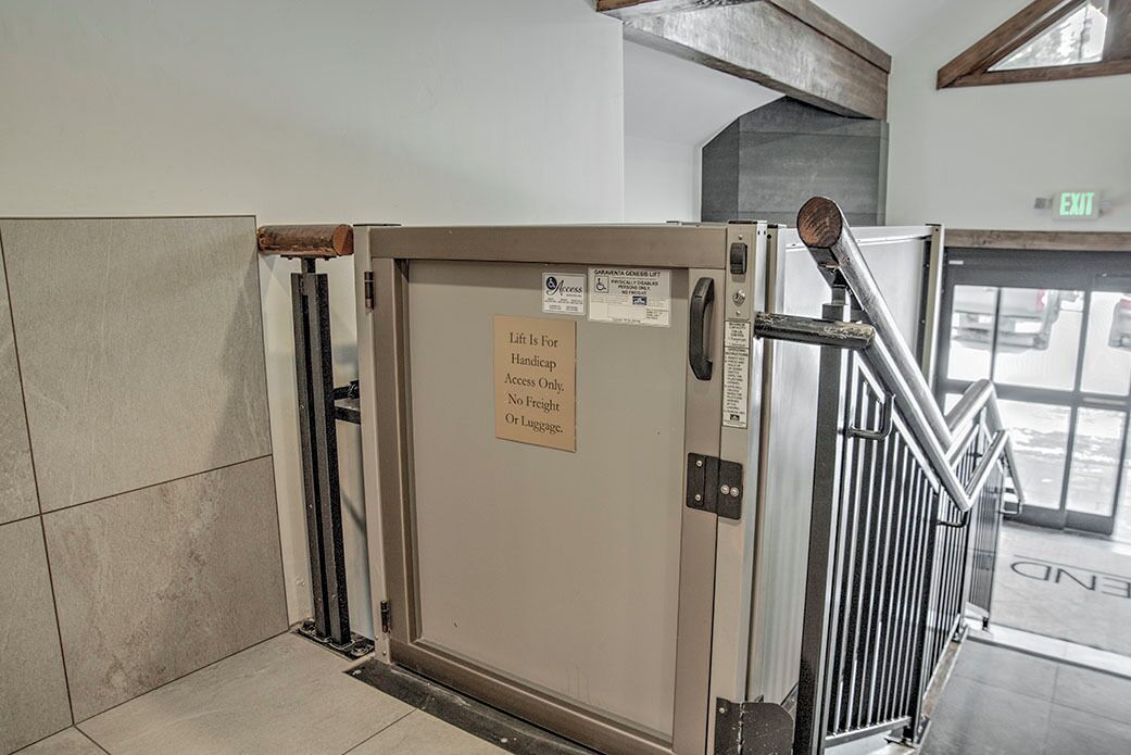 A lift with a sign indicating it is for handicap access only, no freight or luggage.