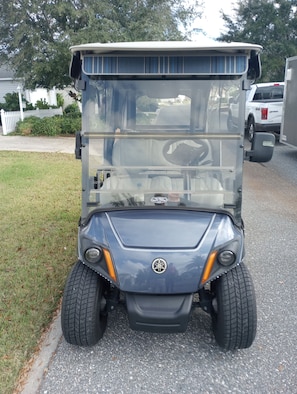 Enjoy golf course navigation with this compact, golf cart designed for ease of use.
