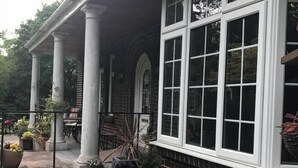 A building with a covered porch, large windows, and columns. - Burleigh House  (Stoke-on-Trent)