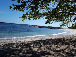 On the beach, black sand
