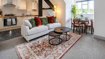 Exclusive Apartment, 1 Double Bed with Sofa bed, Private Bathroom | Living area | 50-inch Smart TV with digital channels, Netflix, streaming services