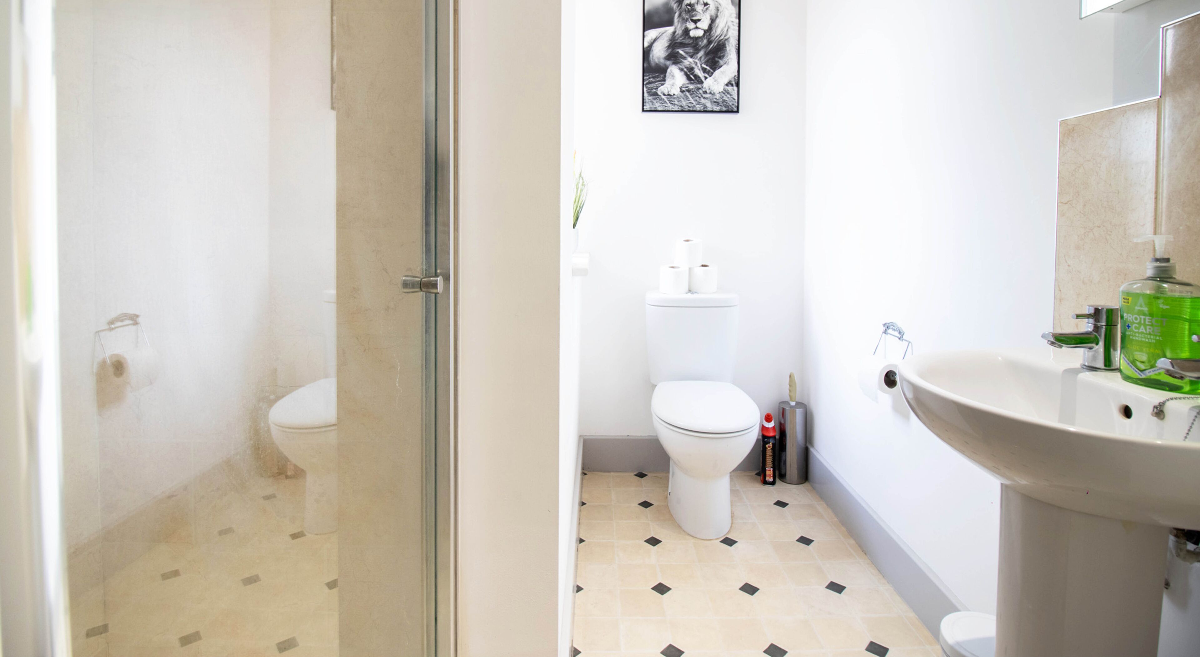 A bathroom with a toilet, bidet, and sink.
