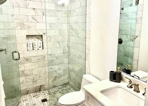 Shower, hair dryer, towels, soap