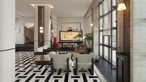 A modern interior with a geometric patterned floor, a seating area with white chairs, and a staircase leading to another level. - Mohan Huating Hotel (Mengla)