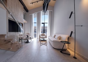 Premium Suite, 1 Bedroom (Loft) | Living area | 65-inch Smart TV with satellite channels, toys