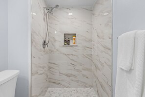 Shower, hair dryer, towels, soap