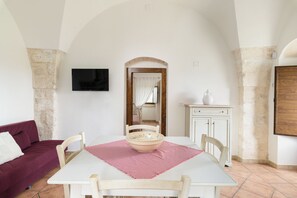 Apartment, Garden View | Living area | 35-inch flat-screen TV with digital channels