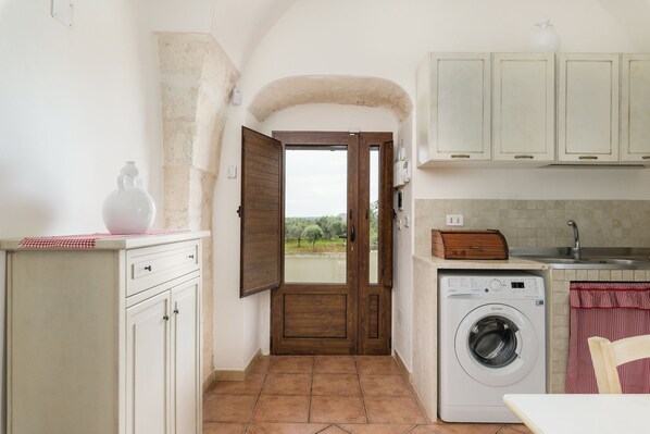 Apartment, Garden View | Living area | 35-inch flat-screen TV with digital channels