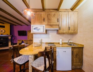 Fridge, microwave, coffee/tea maker, cookware/dishes/utensils