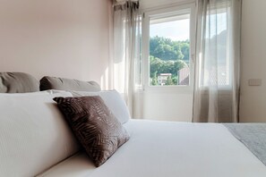 1 غرفة نوم ومكواة/لوح كي وواي فاي وملاءات أسرّة