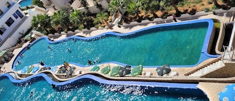 Seasonal outdoor pool, pool umbrellas, sun loungers