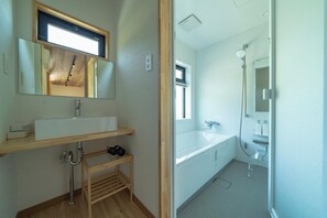 Separate tub and shower, hair dryer, electronic bidet, towels