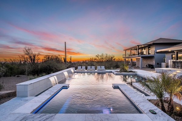 Experience a stunning desert getaway with a private pool and hot tub, offering breathtaking views