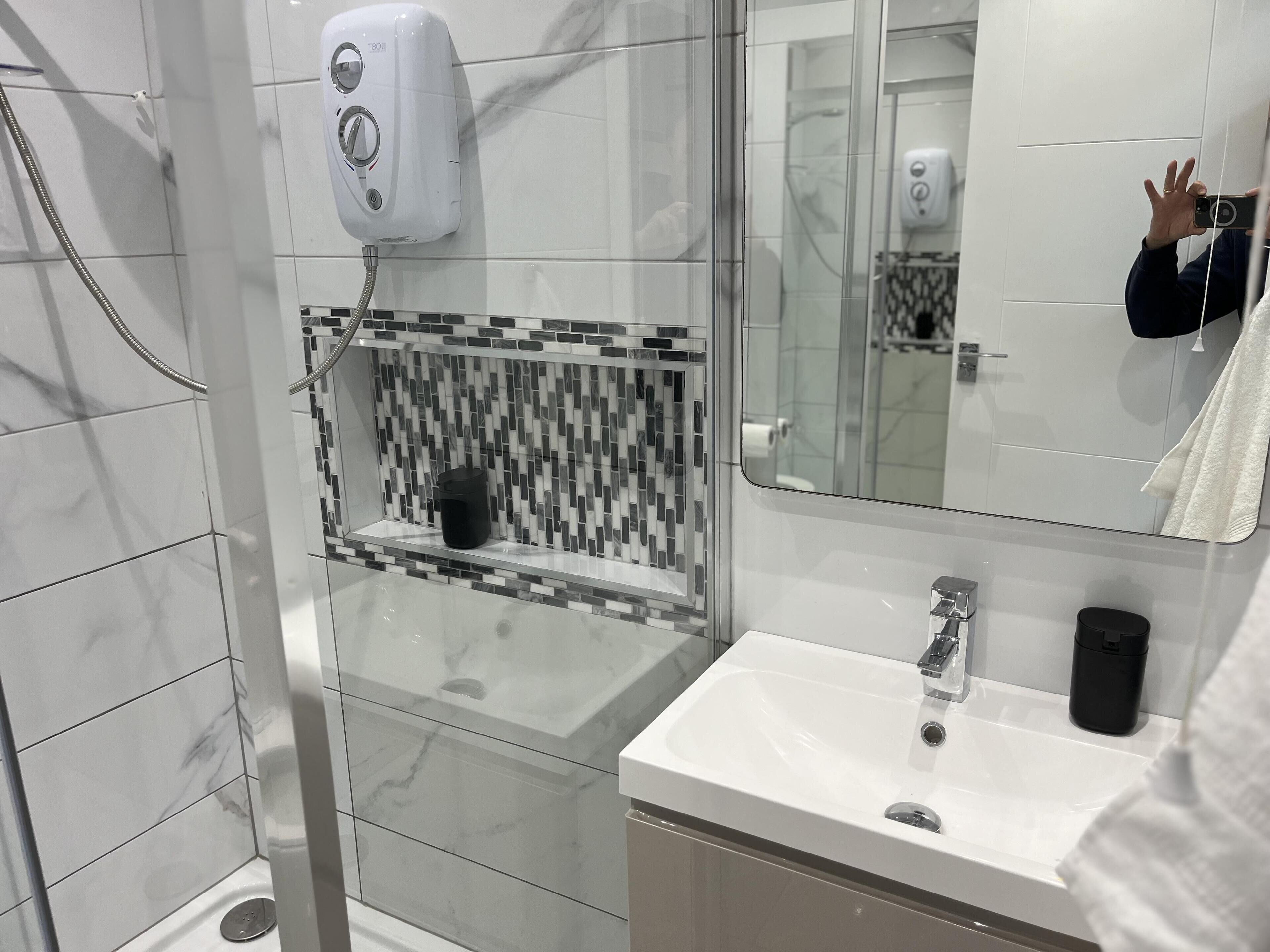 Shower, hair dryer, towels