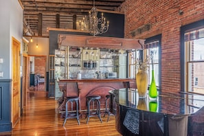 Enjoy cooking in this well-equipped kitchen with a central island, bar stools, and ample counter space.