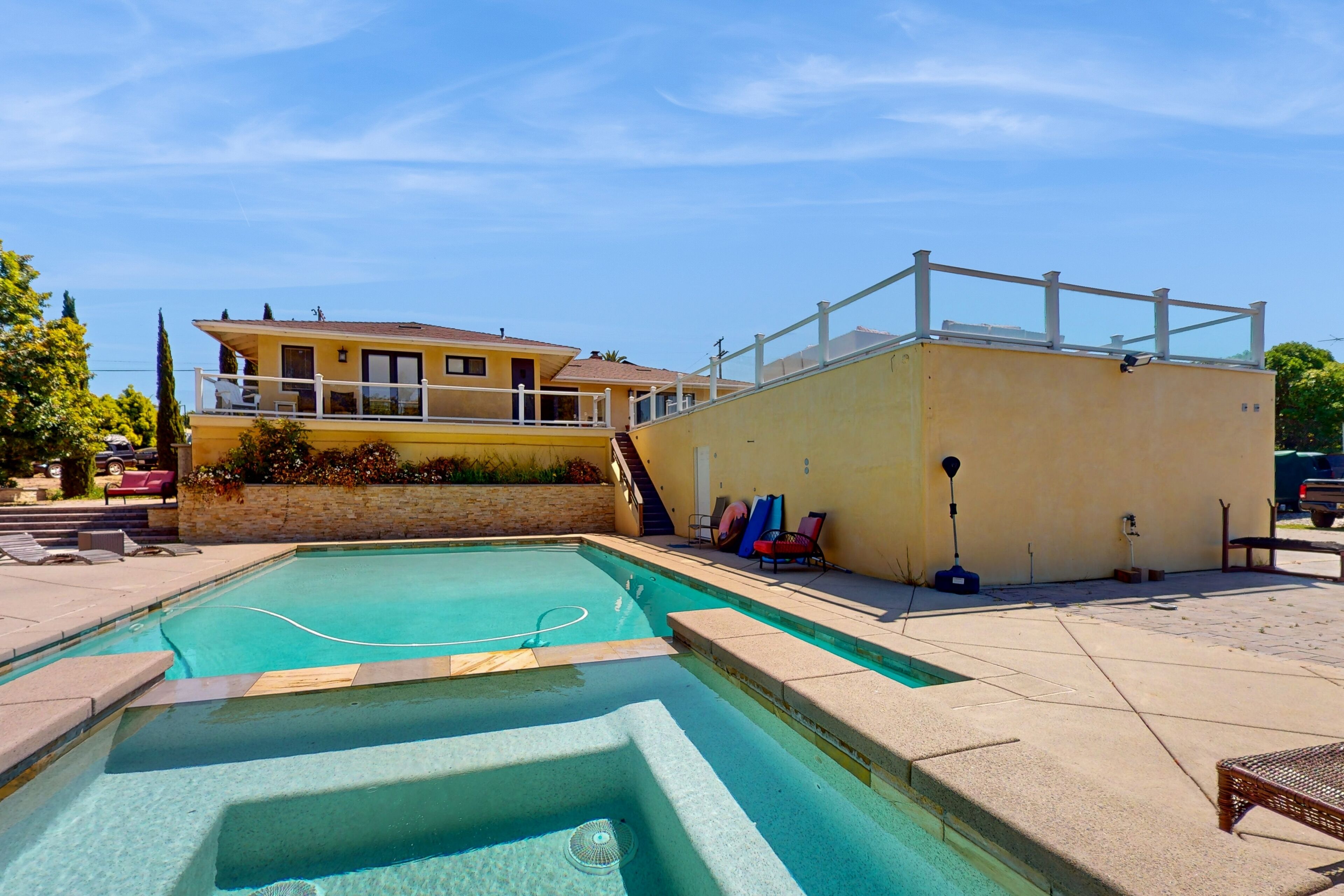 Dog-friendly home near downtown & beach with private heated pool, spa, & grill