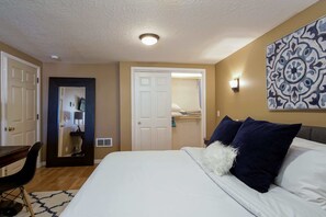 1 bedroom, desk, iron/ironing board, travel crib