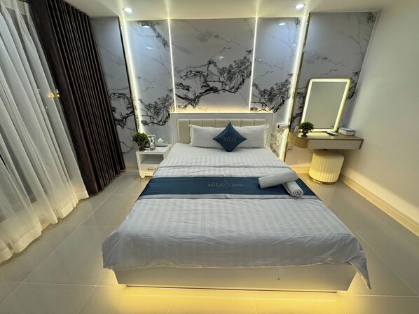 Habitació Deluxe | Minibar, escriptori, wifi gratuïta i roba de llit