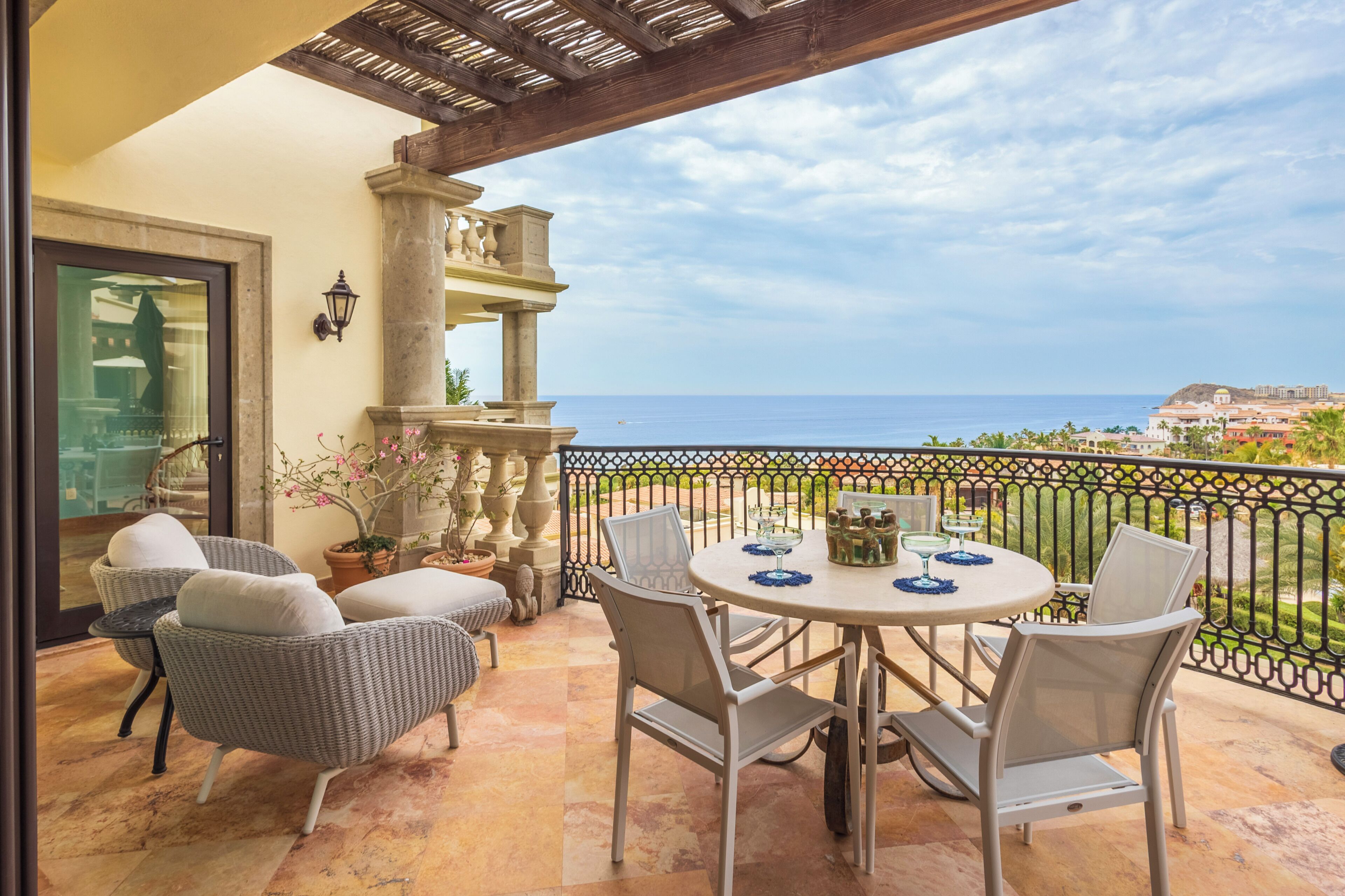 Savor morning coffee on your private terrace while taking in sweeping ocean views and coastal scenery from this elegant outdoor dining space.
