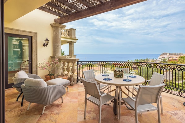 Savor morning coffee on your private terrace while taking in sweeping ocean views and coastal scenery from this elegant outdoor dining space.