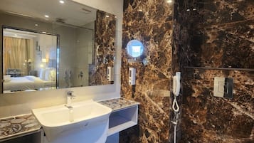 Shower, rainfall showerhead, towels, soap