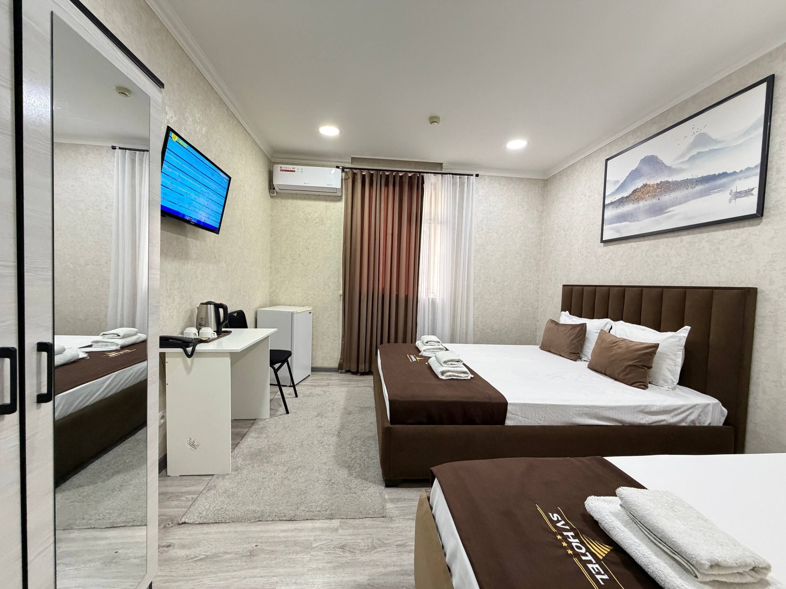 Premium bedding, down duvets, desk, laptop workspace