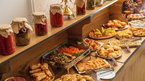 A buffet with various food items including salads, pastries, and sandwiches. - SV Stable Visitor Hotel (Tashkent)