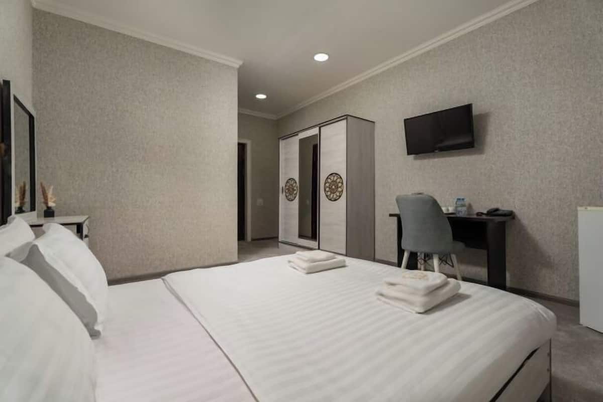 Premium bedding, down comforters, desk, laptop workspace