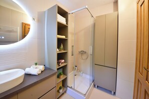 Shower, hair dryer, towels, soap