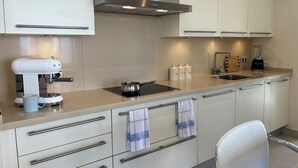 Coffee/tea maker, fridge, microwave, oven