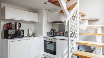 Departamento familiar | Cocina privada | Refrigerador, microondas, parrilla de estufa y cafetera de espresso