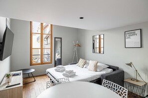 Family Apartment | Living area | 60-inch TV with cable channels