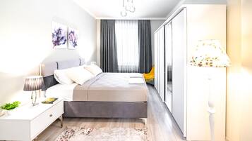 2 dormitorios, tabla de planchar con plancha, cuna de viaje