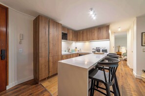Coffee/tea maker, fridge, microwave, oven
