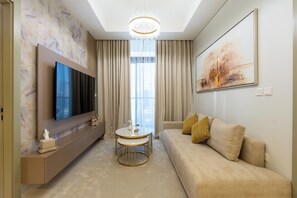 Deluxe Apartment, Balcony, City View | Living area | 50-cm Smart TV with digital channels