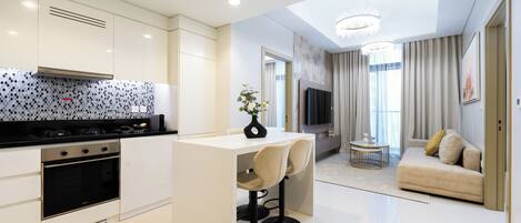 Deluxe Apartment, Balcony, City View | Private kitchen | Fridge, microwave, oven, stovetop